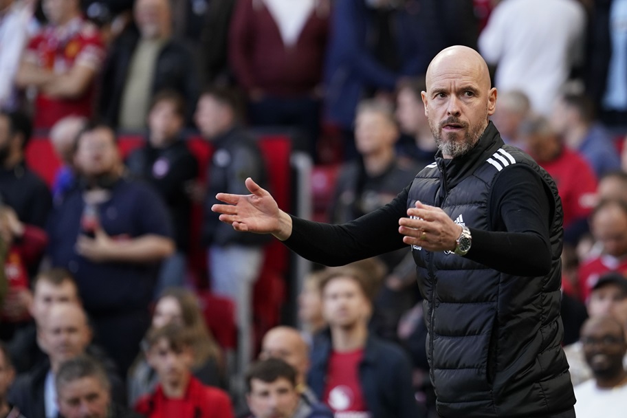 Erik ten Hag gestures on the sideline during a Manchester United game.