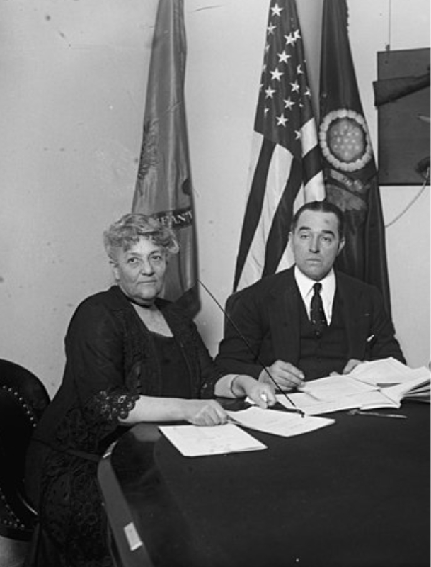 Florence Prag Kahn sitting in a Congressional Committee to amend the Volstead Act, alongside fellow Representative John Phillip Hill, January 7, 1926.