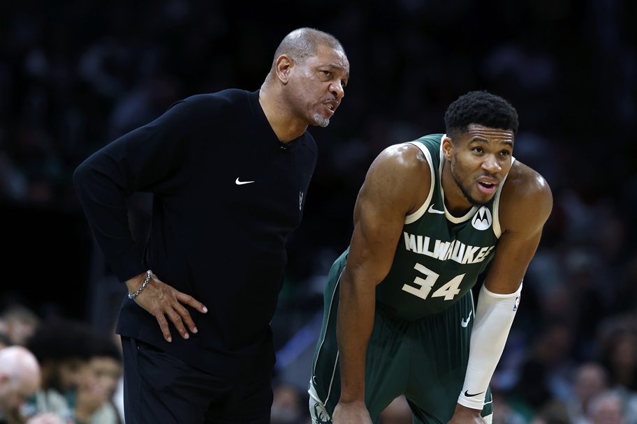 Giannis Antetokounmpo and Doc Rivers talk during a stoppage in NBA play.