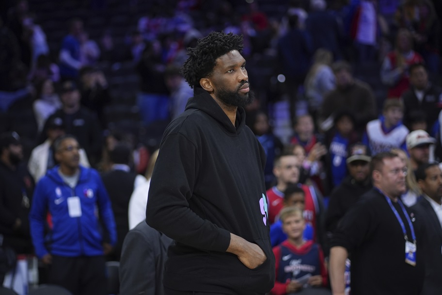 Joel Embiid of the Philadelphia 76ers watches during an NBA game.