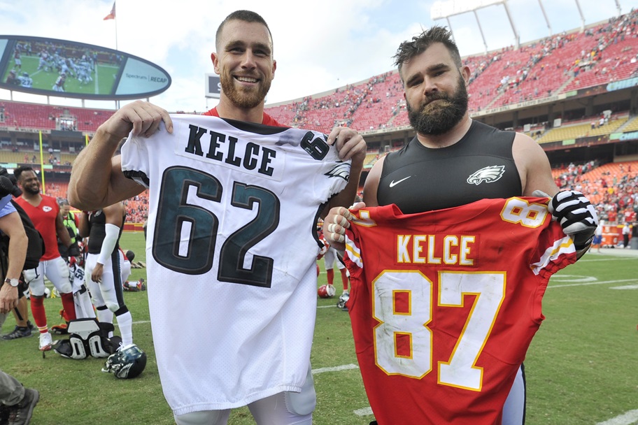 Travis and Jason Kelce pose with their jerseys.