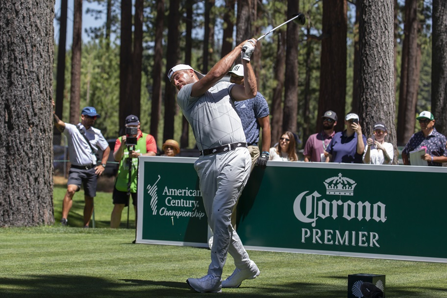 Travis Kelce hits a golf shot