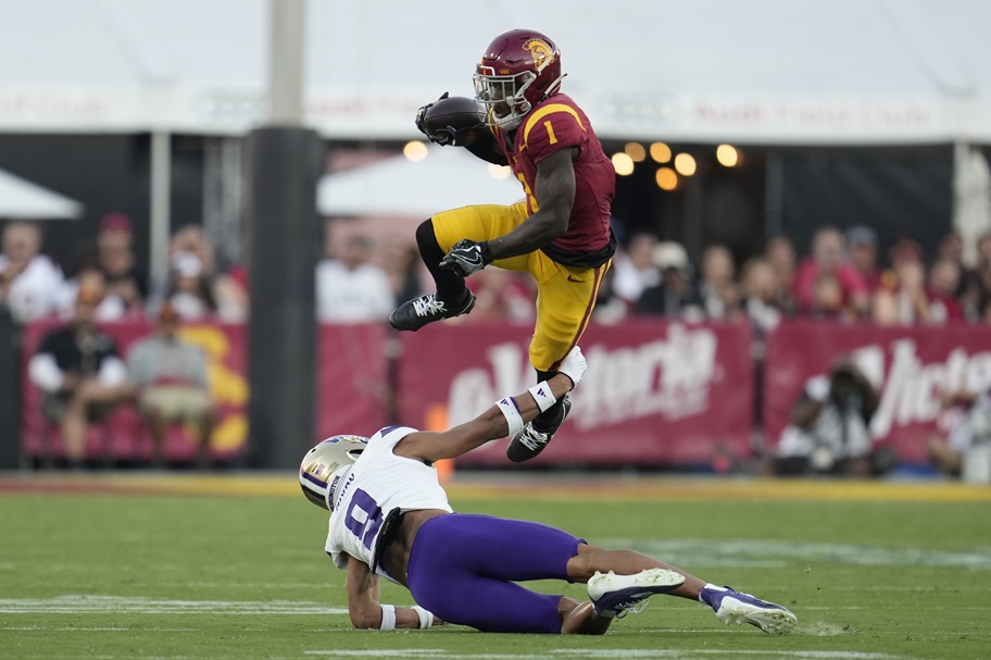 Zachariah Branch of USC jumps over a tackler